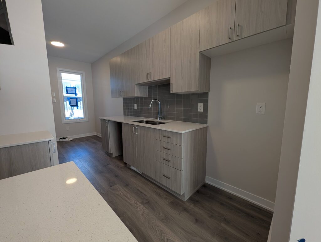 Kitchen in a new Ottawa townhome after appliance delivery, part of getting the home rent-ready